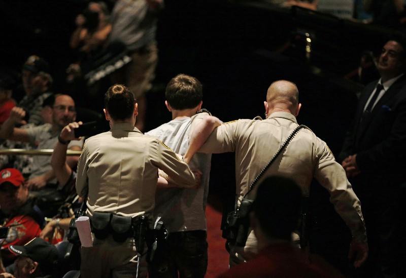 Michael Steven Sandford (center) is suspected of attempting to kill Republican presidential candidate Donald Trump. CREDIT: AP PHOTO/JOHN LOCHER