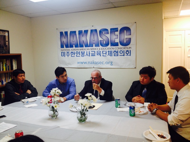 Rep. Gerry Connolly (center) flanked by two undocumented immigrants, Bati Tsogtsaikhan (left) and Max Kim (right). CREDIT: ESTHER YU HSI LEE