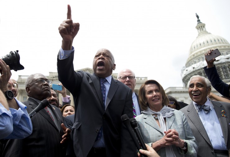 Rep. John Lewis, D-Ga., center, joined by, from left, House Assistant Minority Leader James Clyburn of S.C., Rep. Joseph Crowley, D-N.Y., House Minority Leader Nancy Pelosi of Calif., and Rep. Charles Rangel, D-N.Y., speaks on Capitol Hill in Washington, Thursday, June 23, 2016, after House Democrats ended their sit-in protest. CREDIT: AP Photo/Carolyn Kaster