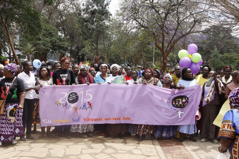Women from Kenya, Uganda, Tanzania, Rwanda and Burundi participate in the world march of woman in Nairobi, Kenya Tuesday, Oct. 13, 2015. The women marched to protest against early marriage, sexual harassment, Female Genital Mutilation and all forms of violence and inequality against women. (AP Photo/Khalil Senosi) CREDIT: AP PHOTO/KHALIL SENOSI