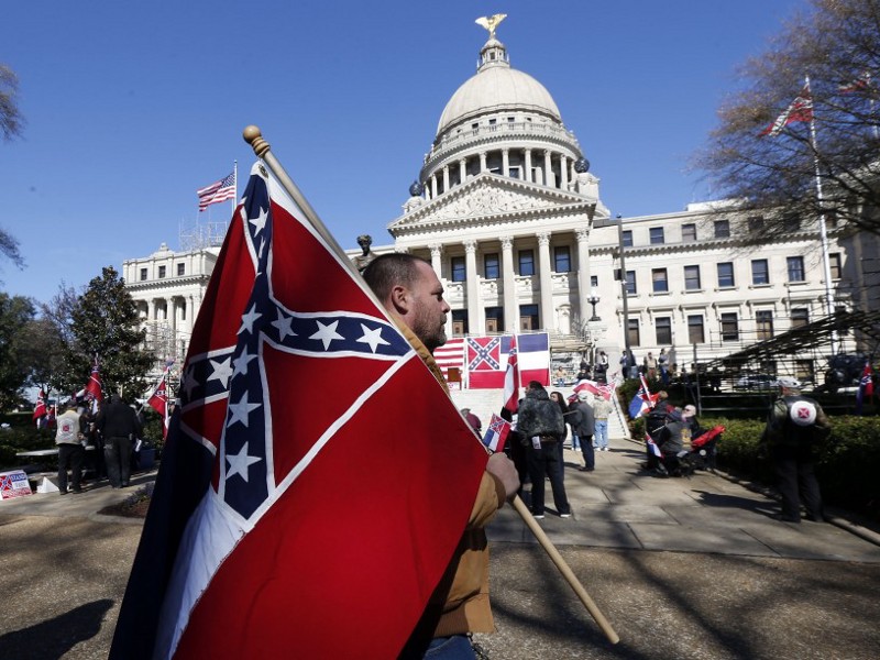 A rally in support of keeping the Confederate battle emblem on the Mississippi state flag CREDIT: Ap/photo Rogelio V. Solis