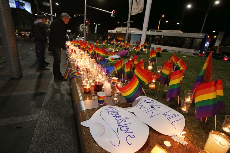 An impromptu memorial is set up in Sydney, Monday, June 13, 2016 CREDIT: AP Photo/Rick Rycroft