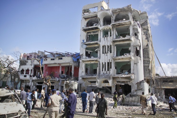 Security forces examine the scene after a bomb attack on Ambassador Hotel in Mogadishu, Somalia, Thursday, June 2, 2016. Somalia’s Islamic extremist rebels, al-Shabab, stormed the hotel, often frequented by government officials and business executives, killing people and taking a number of hostages, police said. (AP Photo/Farah Abdi Warsameh) CREDIT: AP Photo/Farah Abdi Warsameh