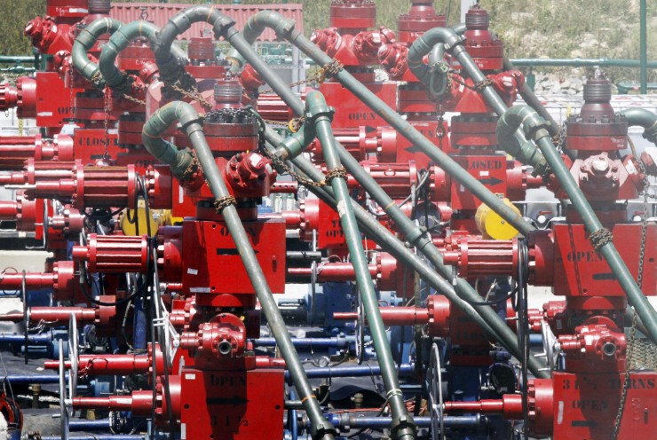 In this photo made on Wednesday, July 27, 2011, rows of pumps where the hydraulic fracturing process in the Marcellus Shale layer to release natural gas was underway at a Range Resources site in Claysville, Pa. CREDIT: AP Photo/Keith Srakocic