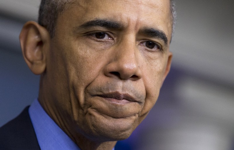In this June 18, 2015 photo, President Barack Obama pauses while speaking in the Brady Press Briefing Room of the White House in Washington, on the church shooting last year in Charleston, S.C. CREDIT: AP PHOTO/MANUEL BALCE CENETA, FILE