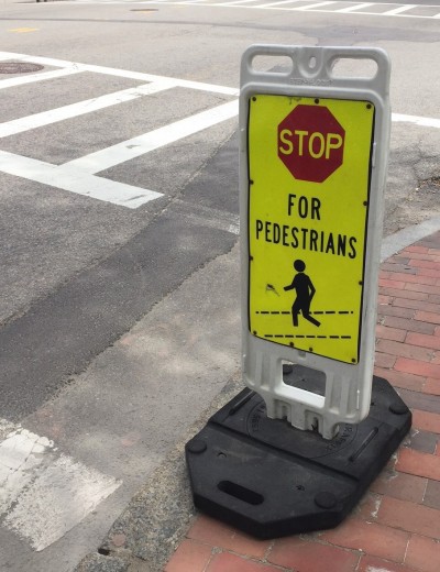 The city has placed temporary pedestrian warning signs across Boston’s South End, since over-sedated drug users keep walking into traffic. CREDIT: Alex Zielinski