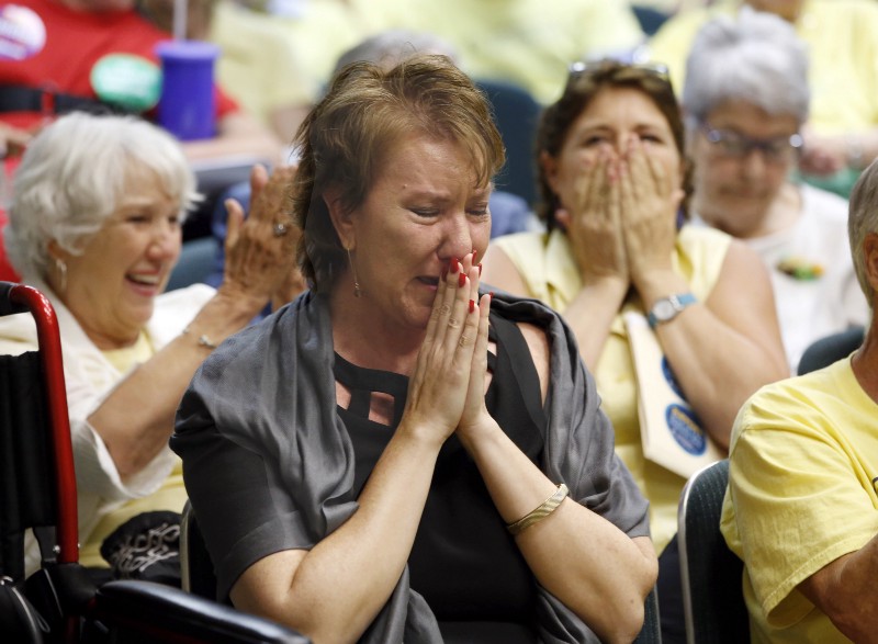 Christy O’Donnell, who has terminal cancer, breaks out into tears after lawmakers advanced right-to-die legislation that she supports, at the Capitol in Sacramento, Calif. CREDIT: AP PHOTO/RICH PEDRONCELLI, FILE