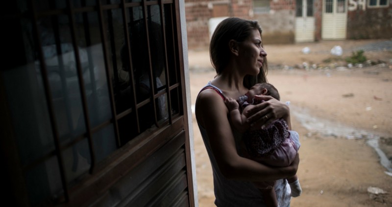 Angelica Pereira holds Luiza outside their house in Santa Cruz do Capibaribe, Pernambuco state, Brazil. Luiza was born in October with a rare condition known as microcephaly. CREDIT: AP PHOTO/FELIPE DANA