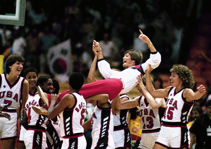 FILE — In this Aug. 8, 1984, file photo, U.S. women’s basketball coach Pat Summitt is carried off by members of the team following their 85–55 win over South Korea in the gold medal game in the Olympics in Los Angeles. CREDIT: PETE LEABO, AP