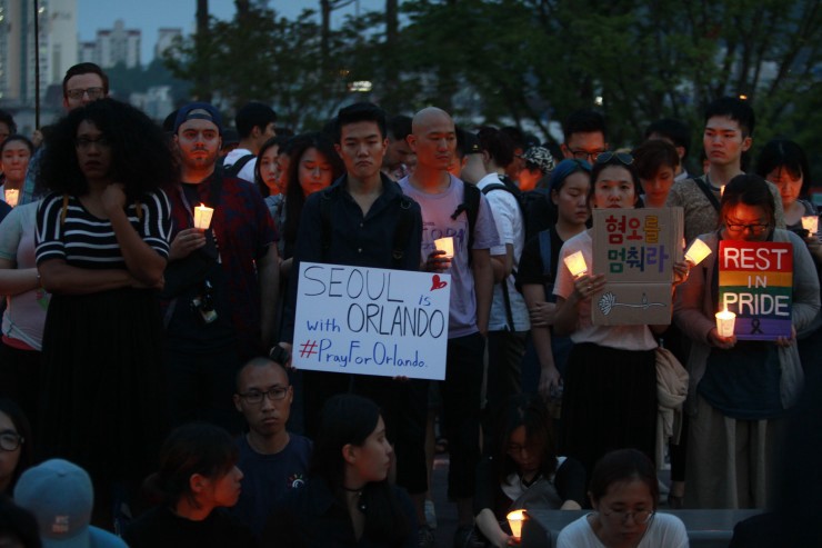 The vigil was held for victims of the nightclub shooting which killed at least 50 people and was the deadliest U.S. mass shooting to date. CREDIT: AP Photo/Ahn Young-joon