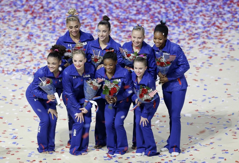 U.S. Olympic women’s gymnastics team members Ashton Locklear, clockwise from top left, Aly Raisman, Madison Kocian, Gabrielle Douglas, Ragan Smith, Simone Biles, MyKayla Skinner and Lauren Hernandez pose for photos after competing in the U.S. Olympic gymnastics trials in San Jose, Calif., Sunday, July 10, 2016. CREDIT: AP Photo/Ben Margot