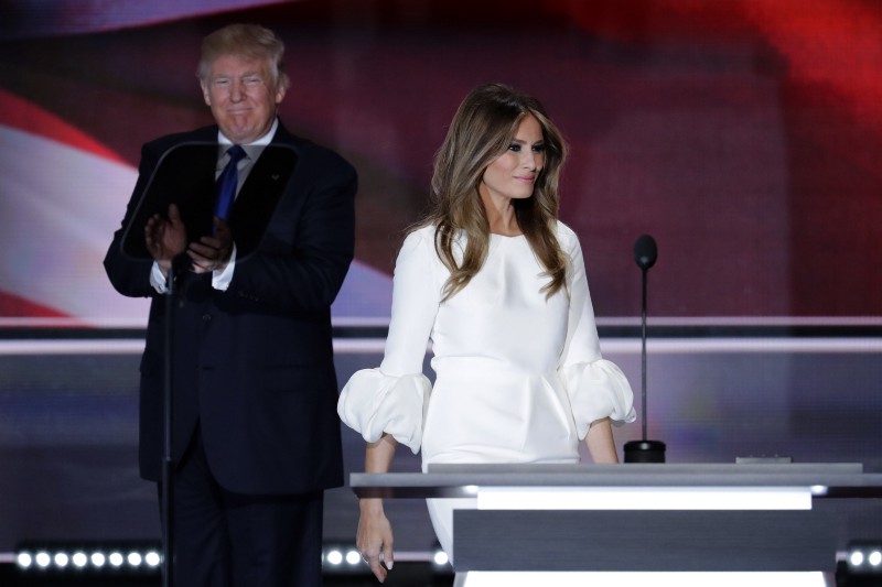 Melania Trump, wife of Republican Presidential Candidate Donald Trump walks to the stage as Donald Trump applaudss during the opening day of the Republican National Convention in Cleveland, Monday, July 18, 2016. CREDIT: AP PHOTO/J. SCOTT APPLEWHITE