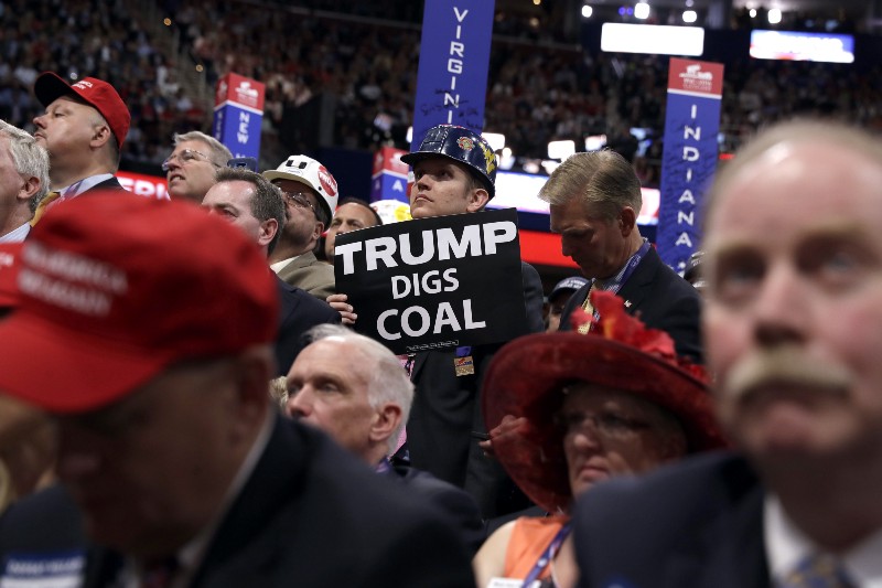 Delegates watch as Republican Presidential Candidate Donald Trump, speaks during the final day of the Republican National Convention in Cleveland, Thursday, July 21, 2016. CREDIT: AP PHOTO/EVAN VUCCI