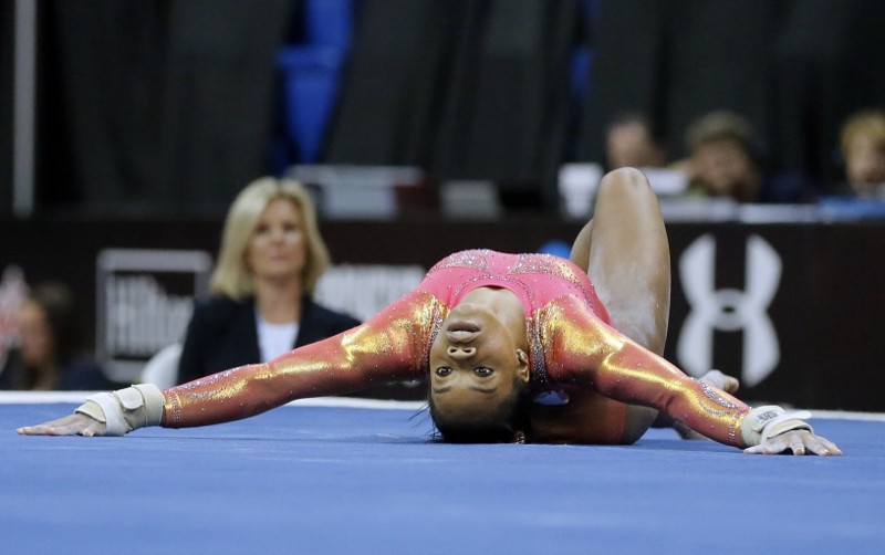 Gabby Douglas competes in the floor exercise during the U.S. women’s gymnastics championships, Friday, June 24, 2016, in St. Louis. CREDIT: AP Photo/Tony Gutierrez