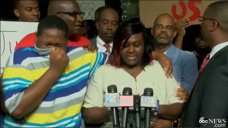 The 15-year-old son of Alton Sterling stands next to his mother at a press conference after his father’s death. CREDIT: ABC