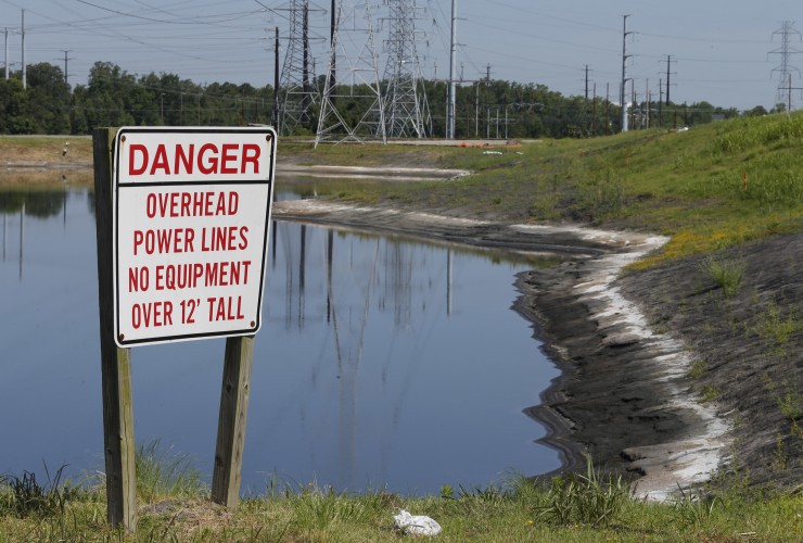 Coal ash pond from an abandoned coal fired power plant. CREDIT: AP Photo/Steve Helber