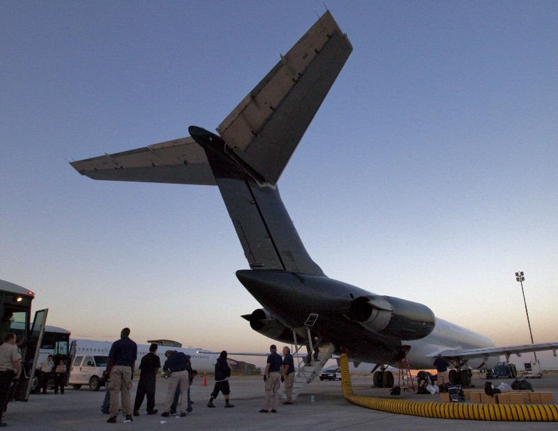 A repatriation flight carrying 80 immigrants to their home country in 2012. CREDIT: AP PHOTO/MATT YORK
