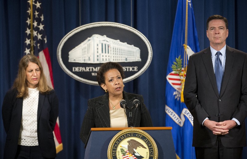 Attorney General Loretta E. Lynch, center, with Health and Human Service (HHS) Secretary Sylvia Burwell, left, and FBI Director James Comey, speaks during a news conference on health care fraud at the Justice Department in Washington, Thursday, June 18, 2015. CREDIT: AP PHOTO/PABLO MARTINEZ MONSIVAIS