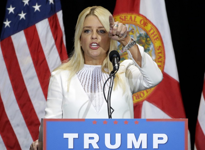 Florida Attorney General Pam Bondi gestures as he speaks to supporters of Republican presidential candidate Donald Trump during a rally Saturday, June 11, 2016, in Tampa, Fla. CREDIT: AP PHOTO/CHRIS O’MEARA