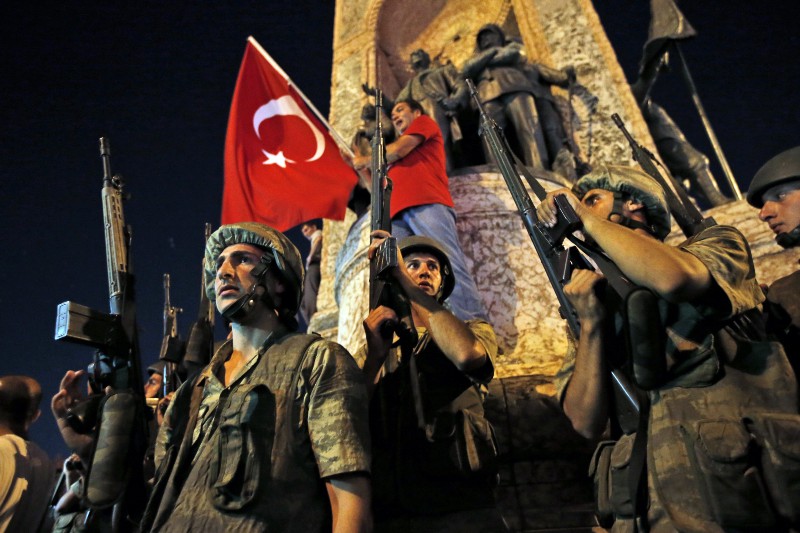 Turkish soldiers secure the area as supporters of Turkey’s President Recep Tayyip Erdogan protest in Istanbul’s Taksim square, early Saturday. CREDIT: AP PHOTO/EMRAH GUREL
