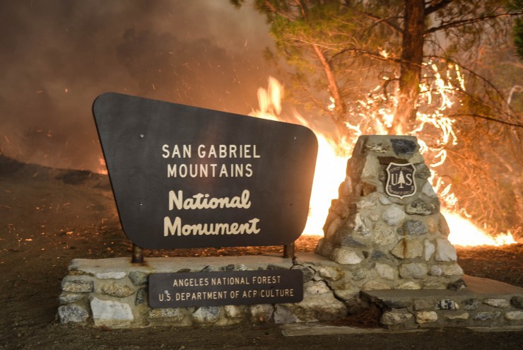 A maker at the entrance of the Angeles National Forest burns on Saturday, July 23, 2016. CREDIT: AP Photo/Ryan Babroff