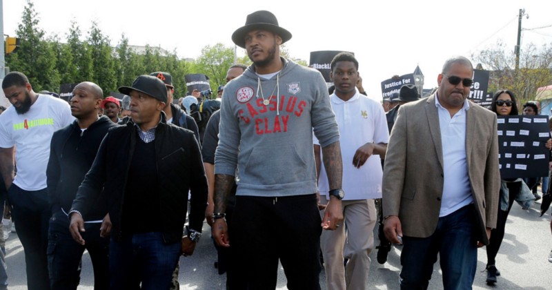 New York Knicks forward Carmelo Anthony, center, marches to Baltimore City Hall to protest the death of Freddie Gray, Thursday, April 30, 2015, in Baltimore. CREDIT: PATRICK SEMANSKY, AP