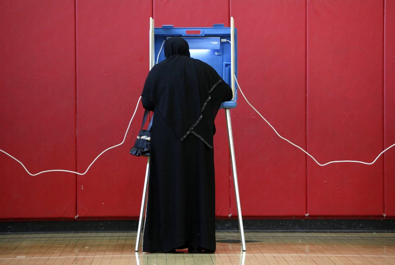 An American Muslim votes in Dearborn, Michigan in 2010. CREDIT: AP PHOTO/PAUL SANCYA