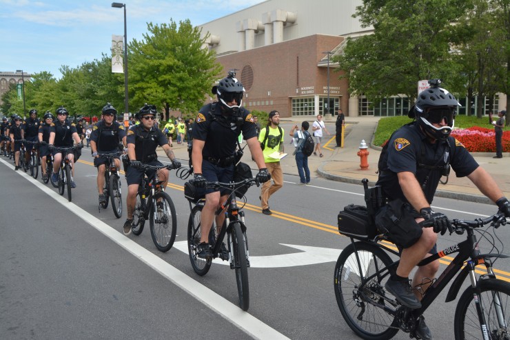 Cops ride alongside people marching in a “Shut Down the RNC” protest. CREDIT: Kira Lerner
