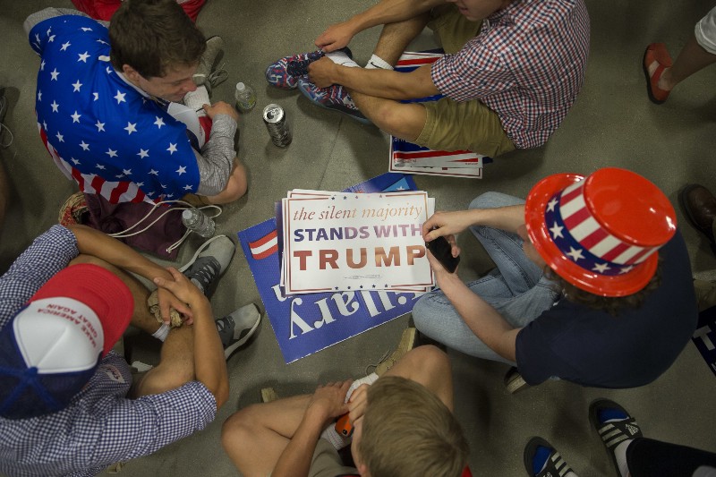 Attendees wait for the arrival of Republican presidential candidate Donald Trump ahead of a campaign rally at the Sharonville Convention Center, Wednesday, July 6, 2016, in Cincinnati. CREDIT: AP PHOTO/JOHN MINCHILLO