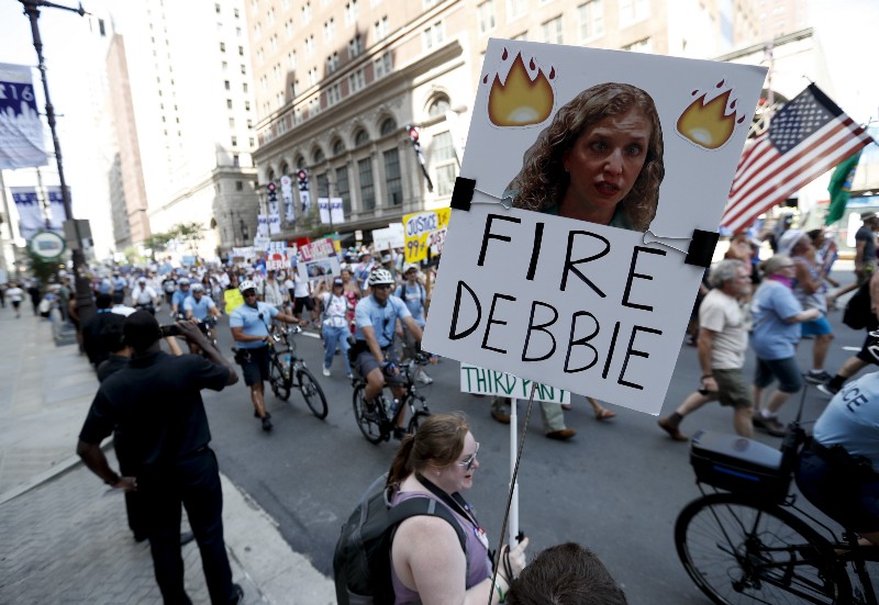 A supporter of Sen. Bernie Sanders, I-Vt., holds up a sign call calling for Debbie Wasserman Schultz, chairwoman of the Democratic National Committee to be fired, Sunday, July 24, 2016, in Philadelphia. CREDIT: AP PHOTO/ALEX BRANDON
