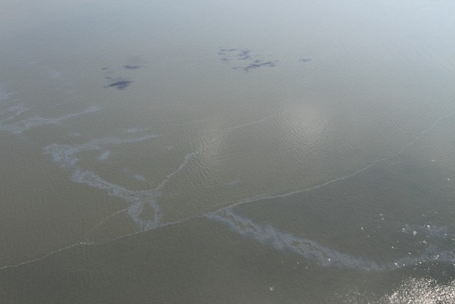 A sheen on the Gulf waters shows where oil is leaking from a rig. CREDIT: Gulf Restoration Network