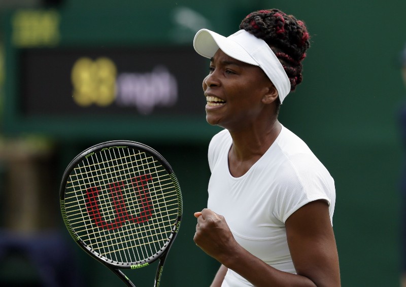 Venus Williams of the U.S celebrates a point against Maria Sakkari of Greece during their women’s singles match on day four of the Wimbledon Tennis Championships in London, Thursday, June 30, 2016. CREDIT: TIM IRELAND, AP