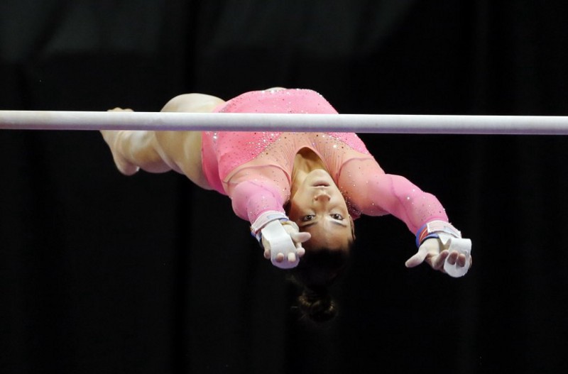 Aly Raisman competes on the uneven bars during the U.S. women’s gymnastics championships, Friday, June 24, 2016, in St. Louis. CREDIT: AP Photo/Tony Gutierrez