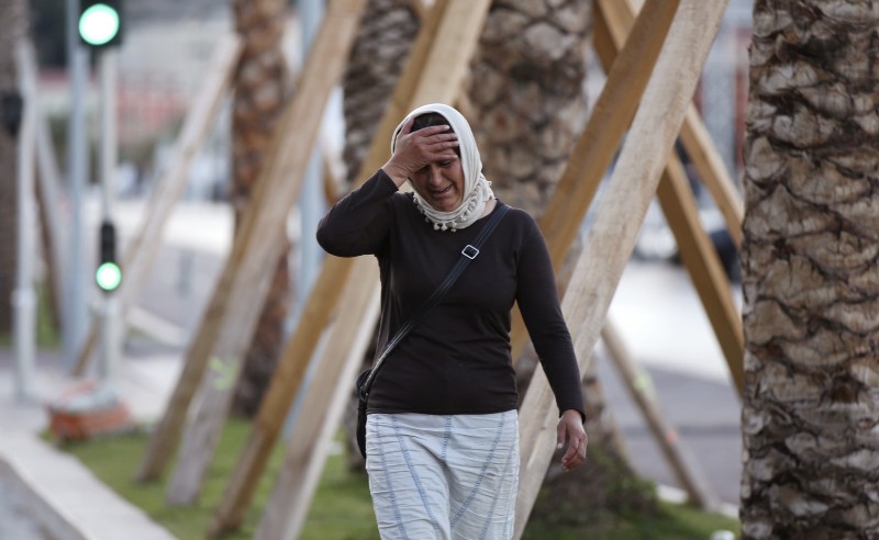 A woman cries asking for her son as she walk near the scene of the attack in Nice, France, Friday, July 15, 2016. CREDIT: AP PHOTO/LUCA BRUNO
