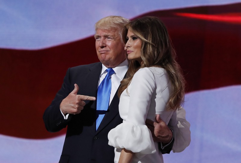 8Republican presidential candidate Donald Trump, right, stands with his wife Melania on stage at the Republican National Convention. CREDIT: AP PHOTO/CAROLYN KASTER