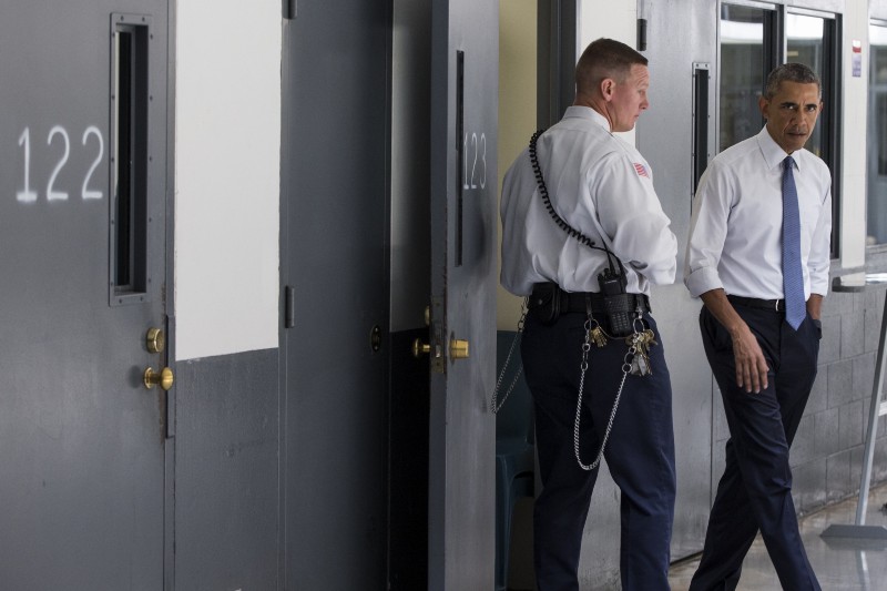 President Barack Obama is led on a tour by correctional officer Ronald Warlick during a visit to the El Reno Federal Correctional Institution in El Reno, Okla., Thursday, July 16, 2015. CREDIT: AP PHOTO/EVAN VUCCI