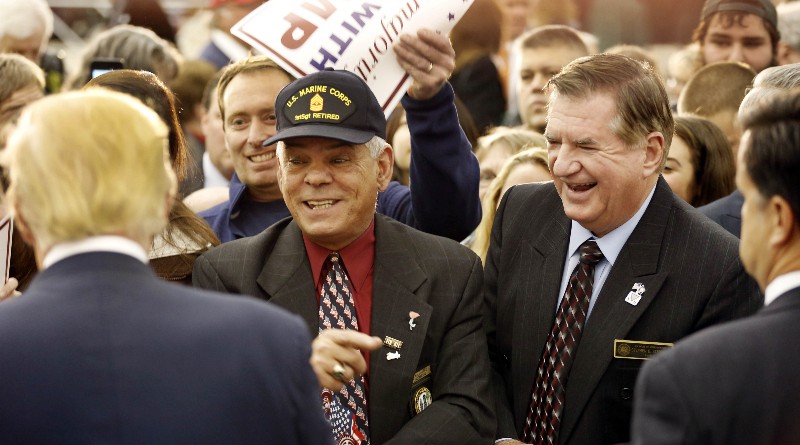 New Hampshire state Reps Stephen Stepanek, right, and Al Baldasaro speak with Donald Trump in Waterville Valley, NH, Dec. 1, 2015. CREDIT: AP PHOTO/JIM COLE