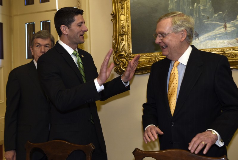 House Speaker Paul Ryan of Wis., center, jokes with Senate Majority Leader Mitch McConnell of Ky., on Capitol Hill in Washington, Wednesday, April 13. CREDIT: AP PHOTO/SUSAN WALSH