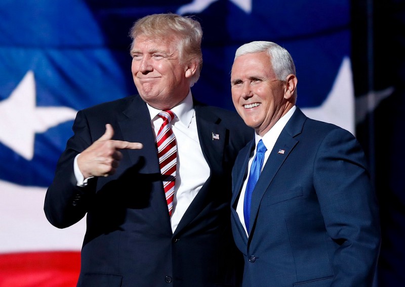Republican Presidential Candidate Donald Trump, points toward Republican Vice Presidential Nominee Gov. Mike Pence of Indiana after Pence’s acceptance speech during the third day session of the Republican National Convention in Cleveland, Wednesday, July 20, 2016. CREDIT: AP PHOTO/MARY ALTAFFER