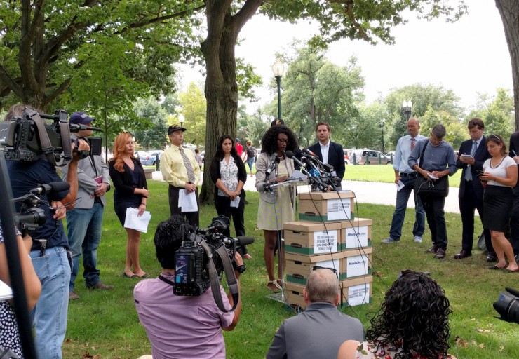 U.S. Army veteran Crystal Cravens speaks Thursday, flanked by fellow veterans calling on Sen. McCain to revoke his support for Trump. CREDIT: Alan Pyke/ThinkProgress