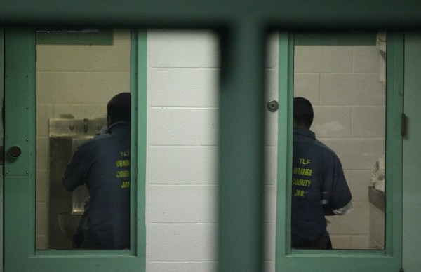 Immigration detainees sit in their cells at the Theo Lacy Facility CREDIT: AP PHOTO