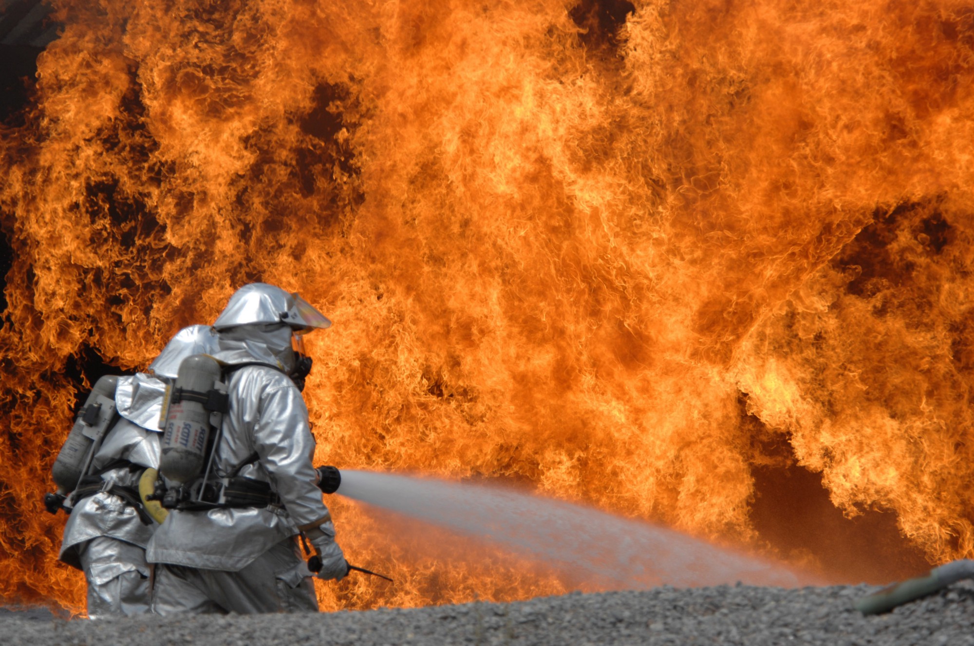 Members of the 20th Civil Engineer Squadron Fire Protection Flight neutralize a live fire during a field training exercise at Shaw Air Force Base, South Carolina. CREDIT: U.S. Air Force/Airman First Class Kathrine McDowell/FLICKR