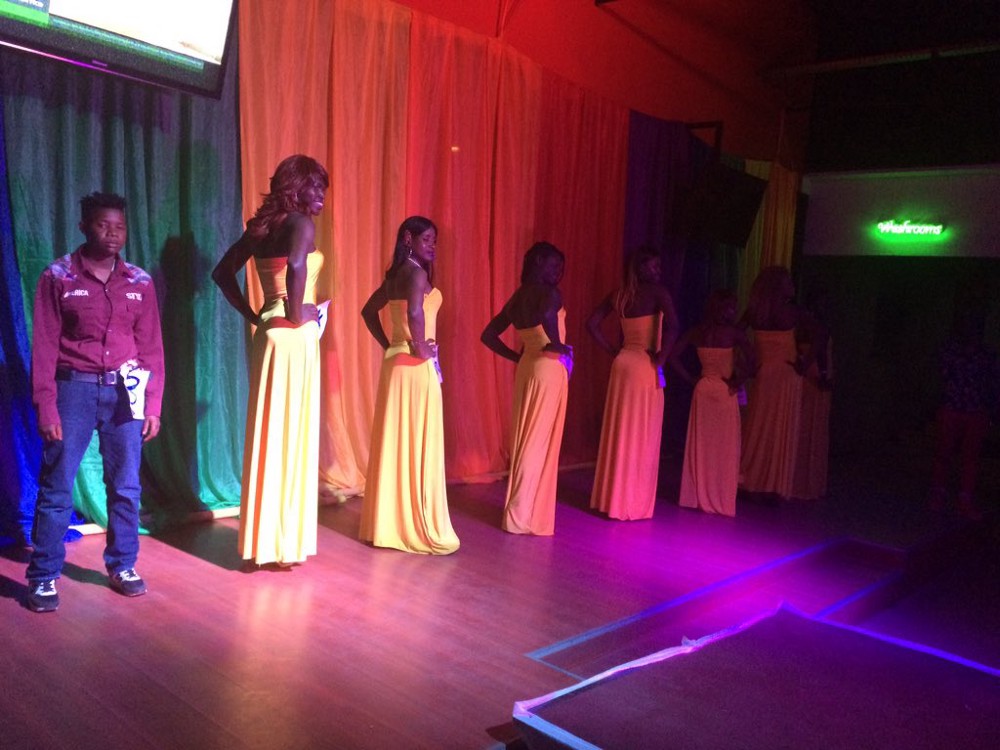 Contestants in the Mr./Ms./Mx. Pride Uganda pageant line the stage before the event was shut down by a police raid. CREDIT: Twitter/PrideUganda2016