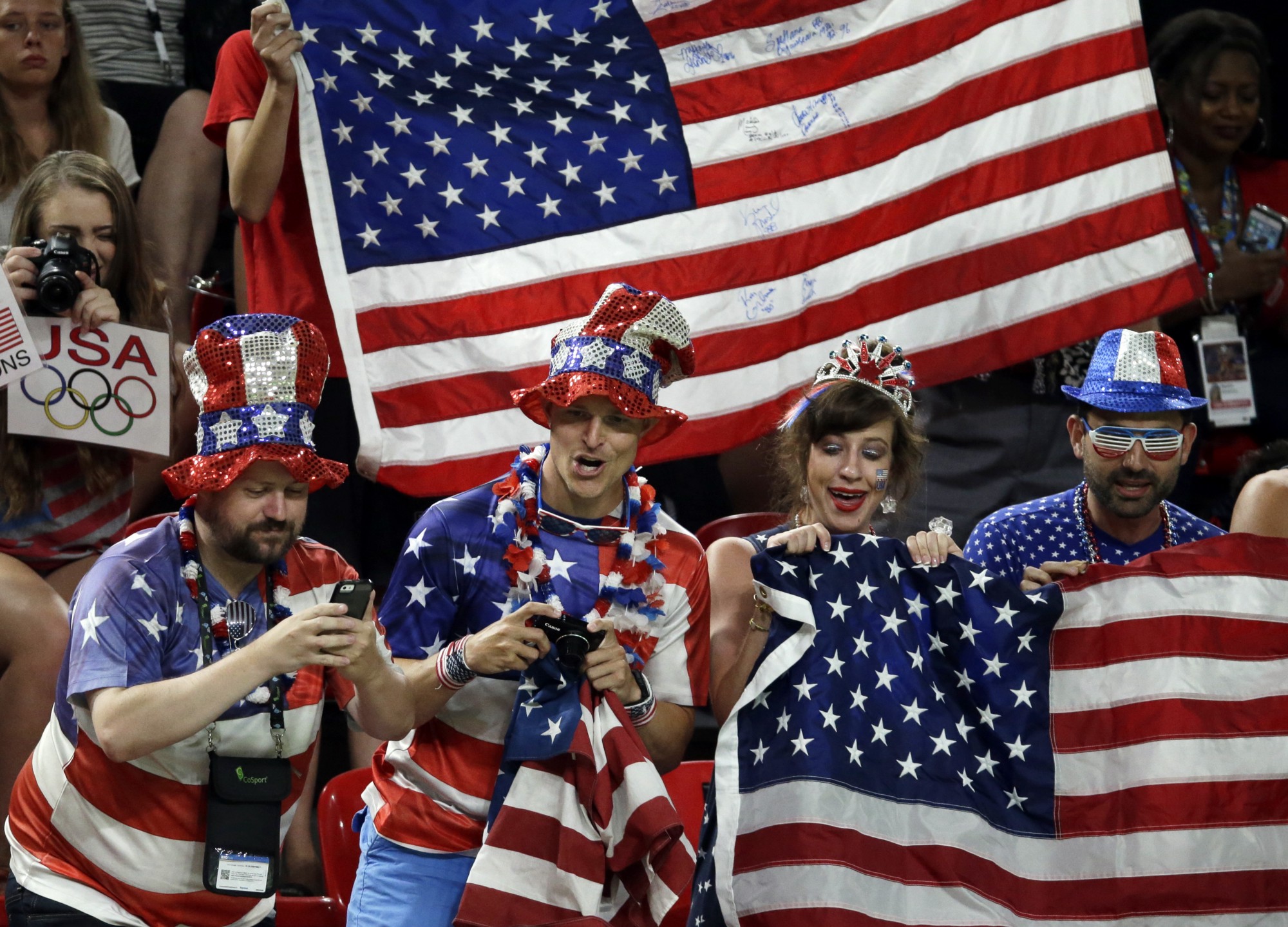 U.S. fans cheer for their gymnasts during the artistic gymnastics women’s team final at the 2016 Summer Olympics in Rio de Janeiro, Brazil CREDIT: AP PHOTO/REBECCA BLACKWELL