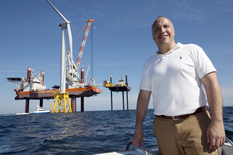 Deepwater Wind CEO Jeffery Grybowski stands on a boat during a media tour of Deepwater Wind’s project off Block Island, R.I., Monday, Aug. 15, 2016. Deepwater Wind’s $300 million five-turbine wind farm off Block Island is expected to be operational this fall. CREDIT: AP PHOTO/MICHAEL DWYER
