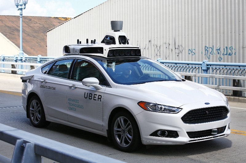 A self-driving Ford Fusion hybrid car is test driven in Pittsburgh. CREDIT: AP PHOTO/ JARED WICKERMAN
