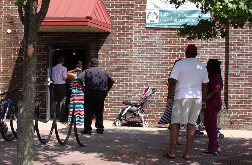 West Calumet Complex Residents line up to attend a community meeting about their future. CREDIT: EAST CHICAGO SOURCE