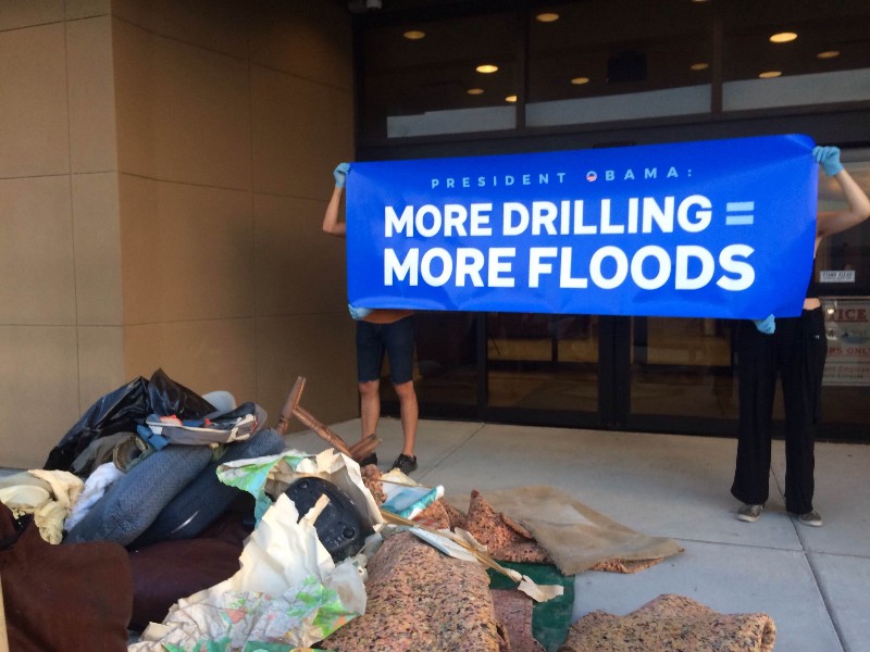 Activists deliver flood debris to the Bureau of Ocean Energy Management in New Orleans on Tuesday, the day before the agency leased more Gulf waters for oil extraction. CREDIT: COURTESY 350.ORG