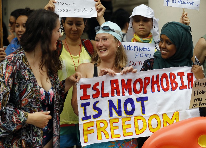 Activists protest outside the French Embassy in London Thursday, August 25 (AP Photo/Frank Augstein)