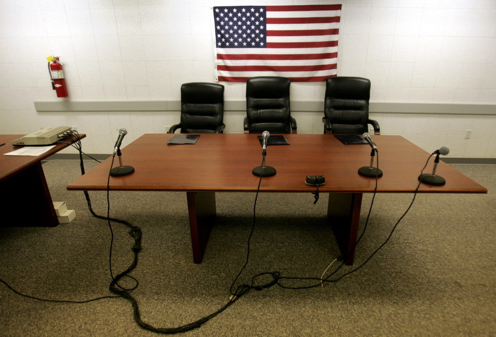 A room inside a military trailer sits ready minutes before a military hearing begins for a Guantanamo detainee, at Guantanamo Bay Naval Base, Cuba. CREDIT: AP PHOTO/BRENNAN LINSLEY